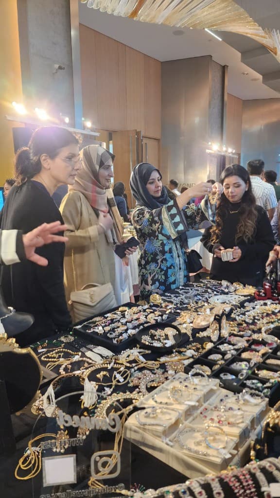 Sopritti Spring Edit — Shimmer Kreation jewellery booth with guests at a Dubai exhibition